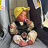 Nyla joined the competition — help win amazing prizes! baby, car_seat, pacifier, yellow_headwrap, infant, sleeping, child, clothing, safety_harness, toes, hand, pink, gray, seat, cute, peaceful, indoors, soft_light, newborn, resting