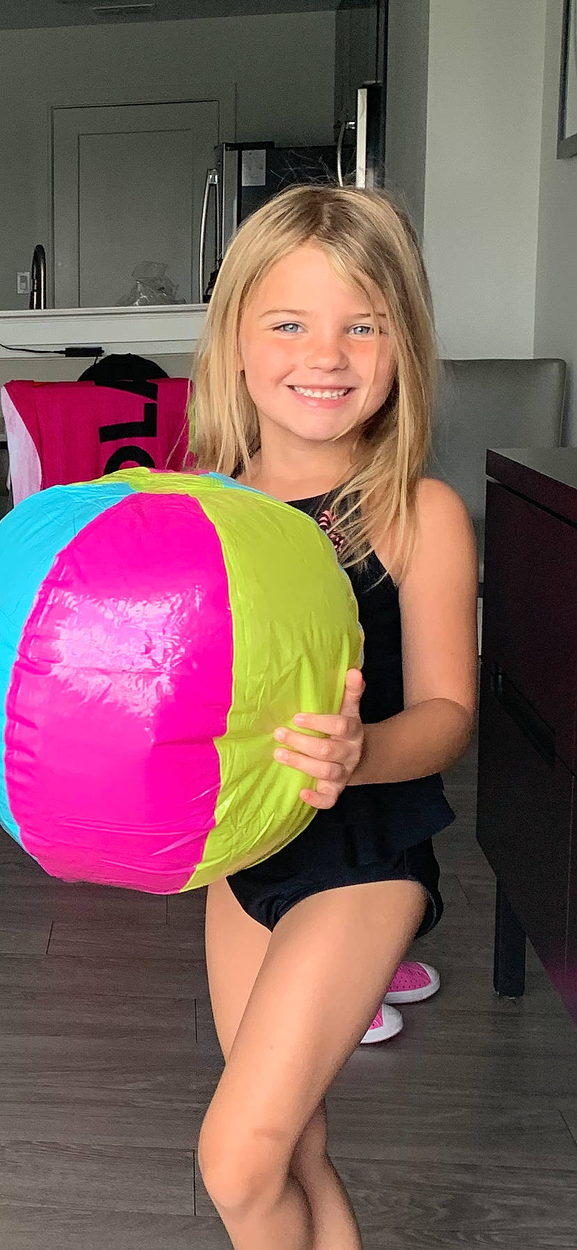 Mckenna is registered to the contest to win money with this photo: abdomen, balloon, chest, facial_expression, hair, hairstyle, joint, joy, knee, leg, muscle, person, pink, shorts, shoulder, smile, sportswear, t_shirt, textile, thigh
