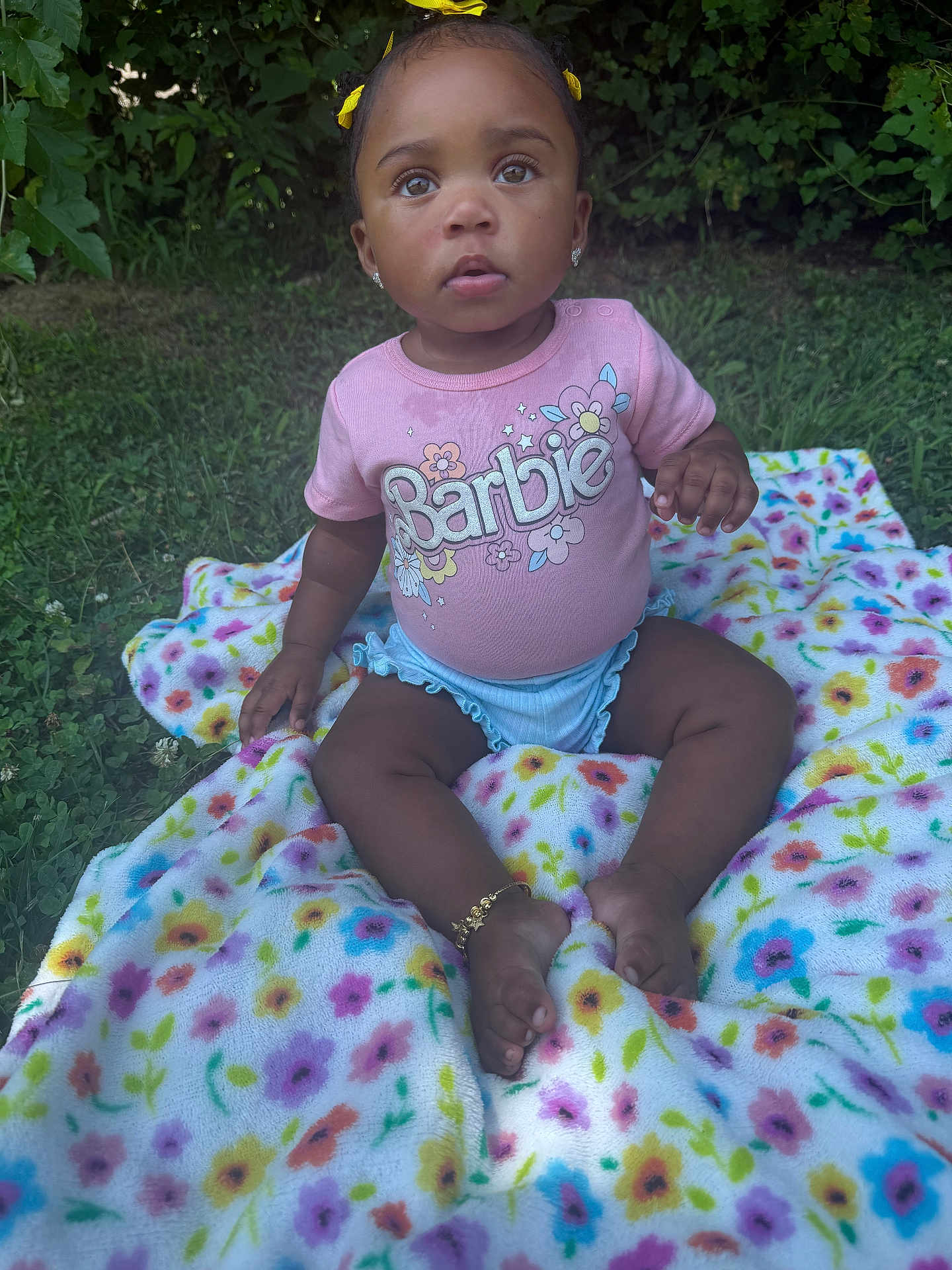 Serenity is registered to the contest to win money with this photo: toddler, child, outdoor, grass, blanket, flower_pattern, pink_shirt, barbie, earrings, bracelet, cute, baby, nature, grass_background, summer, portrait, sitting, innocent, curious, young_child