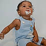 Caden joined the competition — help win amazing prizes! toddler, child, cake, frosting, messy, blue_striped_romper, sitting, curious, face, hands, food, celebration, birthday, cute, indoor, young_child, expression, skin, hair, background
