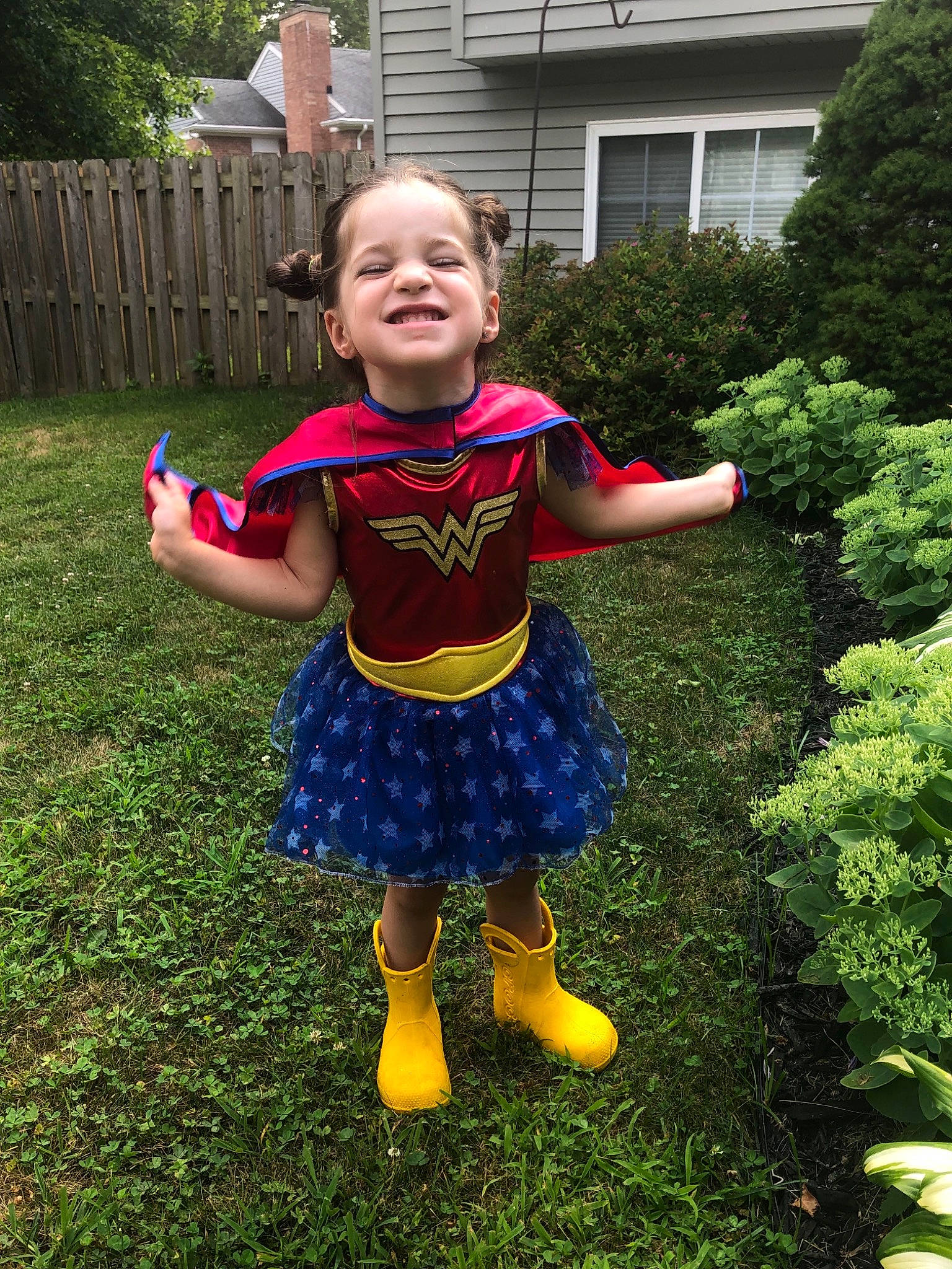 Meredith is registered to the contest to win money with this photo: child, clothing, costume, dress, fictional_character, fun, garden, joy, outerwear, pattern, person, plant, smile, textile, toddler