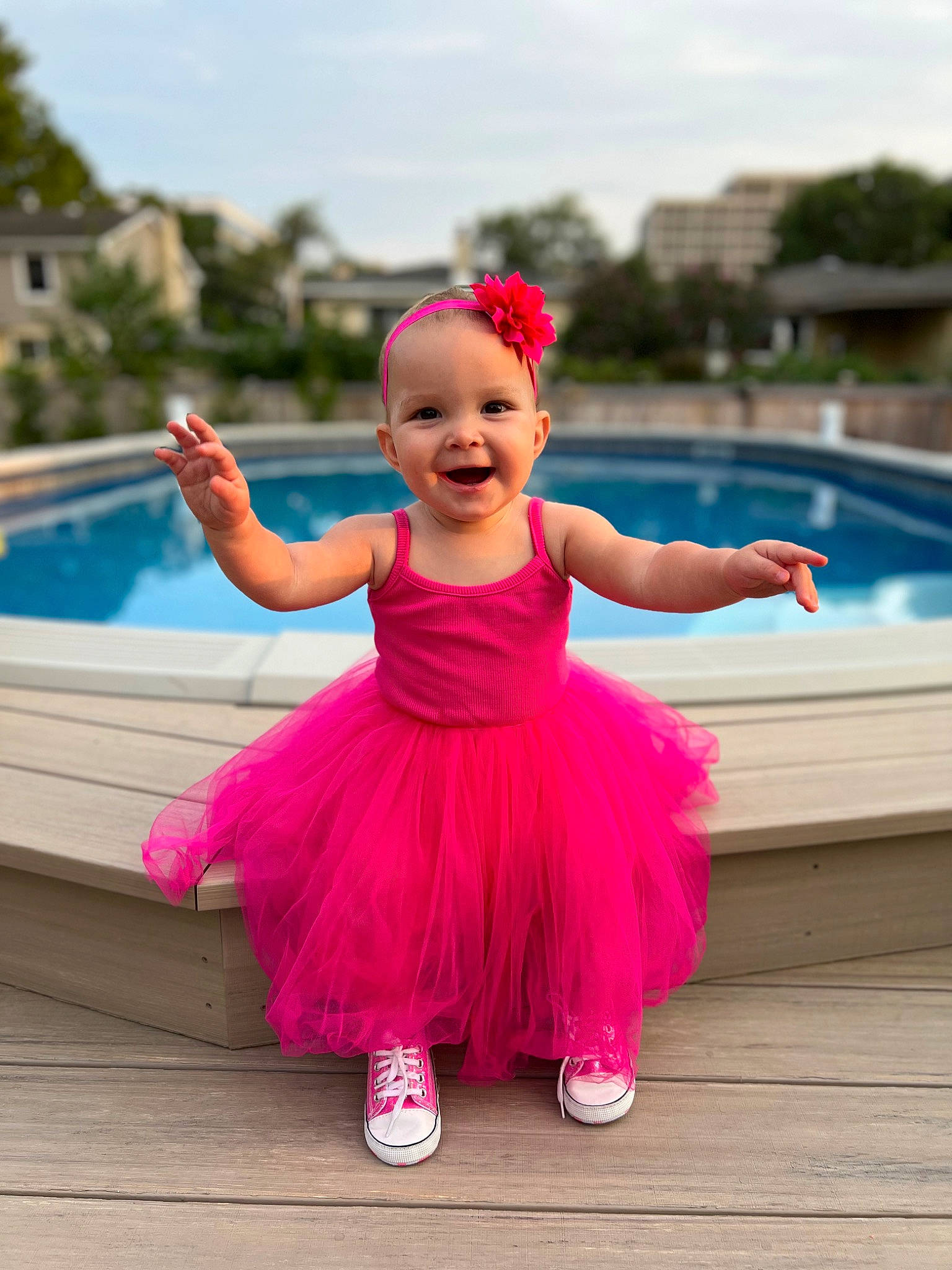 Scarlett is registered to the contest to win money with this photo: baby, baby_toddler_clothing, child, cloud, dress, entertainment, event, fun, happy, joy, leisure, magenta, person, pink, plant, purple, recreation, sky, smile, swimming_pool