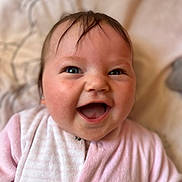 Théa participe au concours pour gagner de l'argent avec cette photo : baby, blanket, cheerful, child, closeup, cute, eyebrows, face, hair, happy, human, indoors, infant, newborn, pink_clothing, portrait, skin, smiling, soft_texture, young_child