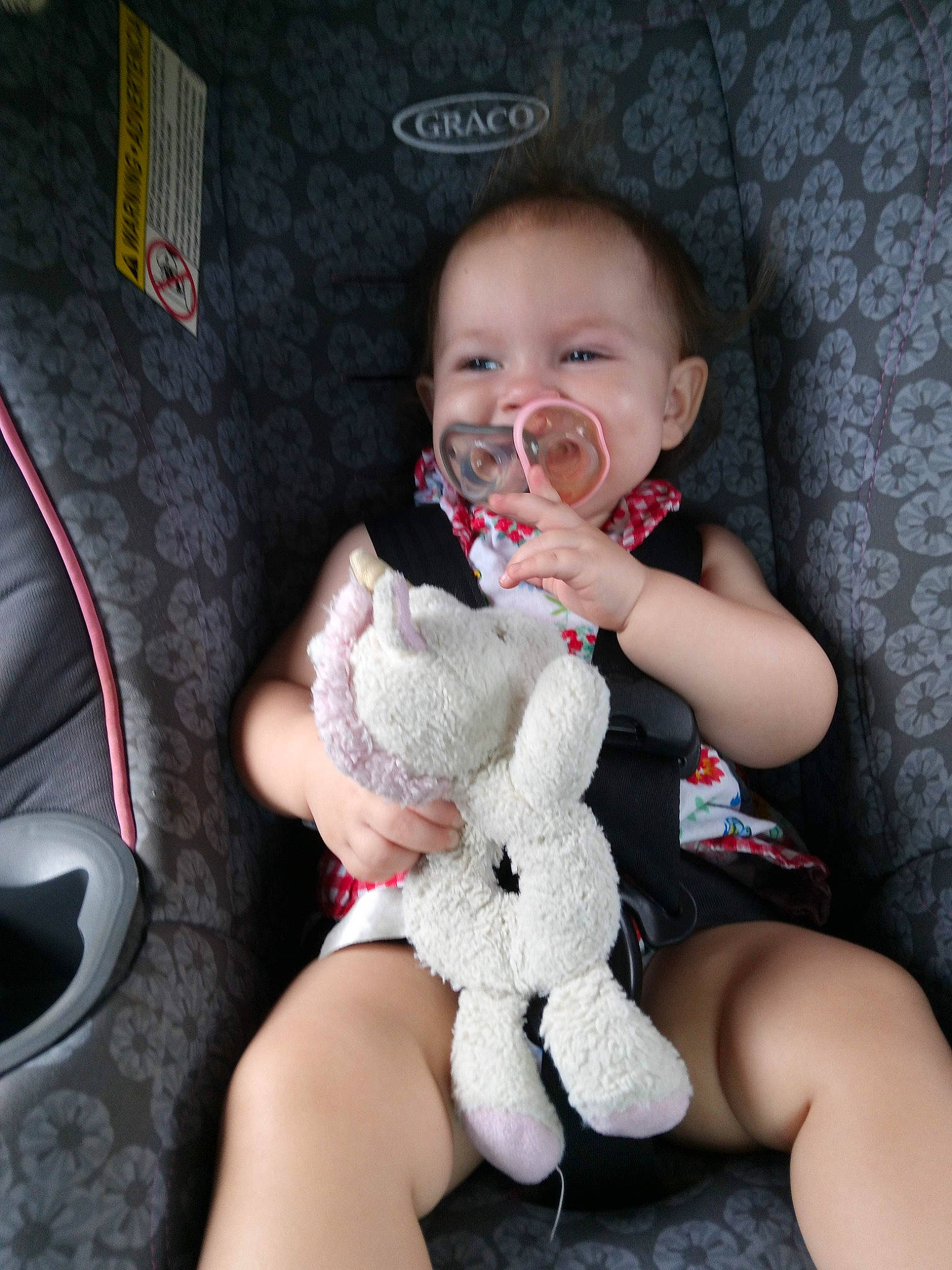 Athena is registered to the contest to win money with this photo: baby, baby_toddler_clothing, cheek, comfort, eye, finger, gesture, happy, head, human_body, human_leg, knee, lap, nail, person, skin, smile, thigh, thumb, toddler