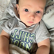 Jaxson is registered to the contest to win money with this photo: baby, infant, face, eyes, hoodie, clothing, blanket, hand, skin, person, portrait, expression, cute, child, soft, resting, young, casual, indoor, comfort