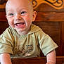 Jaxson joined the competition — help win amazing prizes! baby, smiling, happy, child, face, hands, wooden_table, sweater, indoor, portrait, cute, toddler, clothing, expression, head, skin, person, table, background, warm_colors