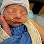 newborn, baby, sleeping, infant, hat, blue_clothing, blanket, feeding_tube, hospital, close_up, person, hand, wrapped, resting, cute, face, skin, peaceful, medical, treatment
