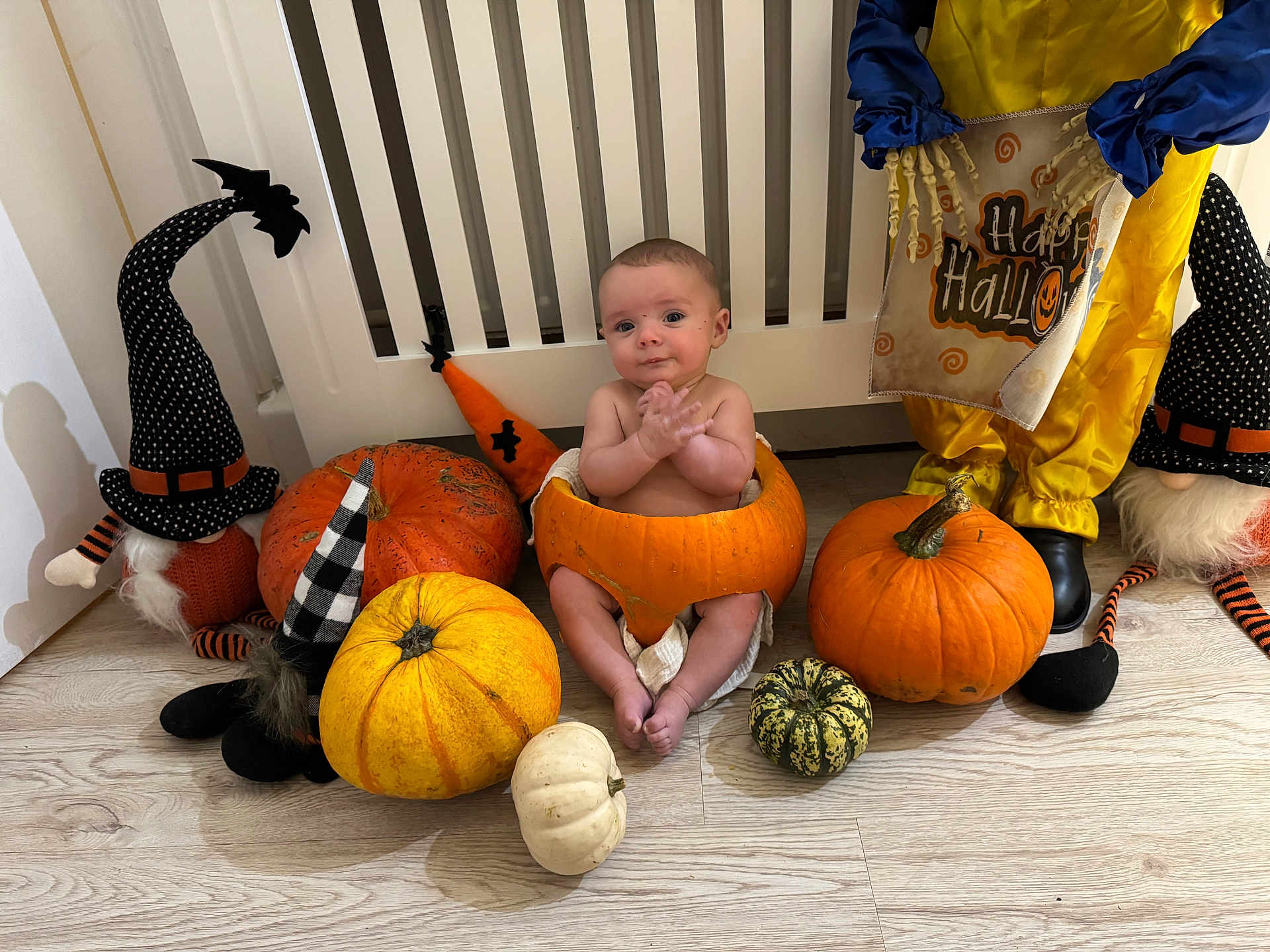 Casper joined the competition — help win amazing prizes! baby, pumpkin, halloween, costume, decoration, gnome, witch_hat, floor, wood_floor, skeleton, sign, orange, yellow, white, black, baby_boy, holiday, festive, indoors, cute