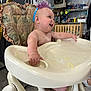 baby, birthday, cake, celebration, child, dining, face, food, furniture, happy, headband, high_chair, indoor, messy, party, person, plush, room, seat, smiling