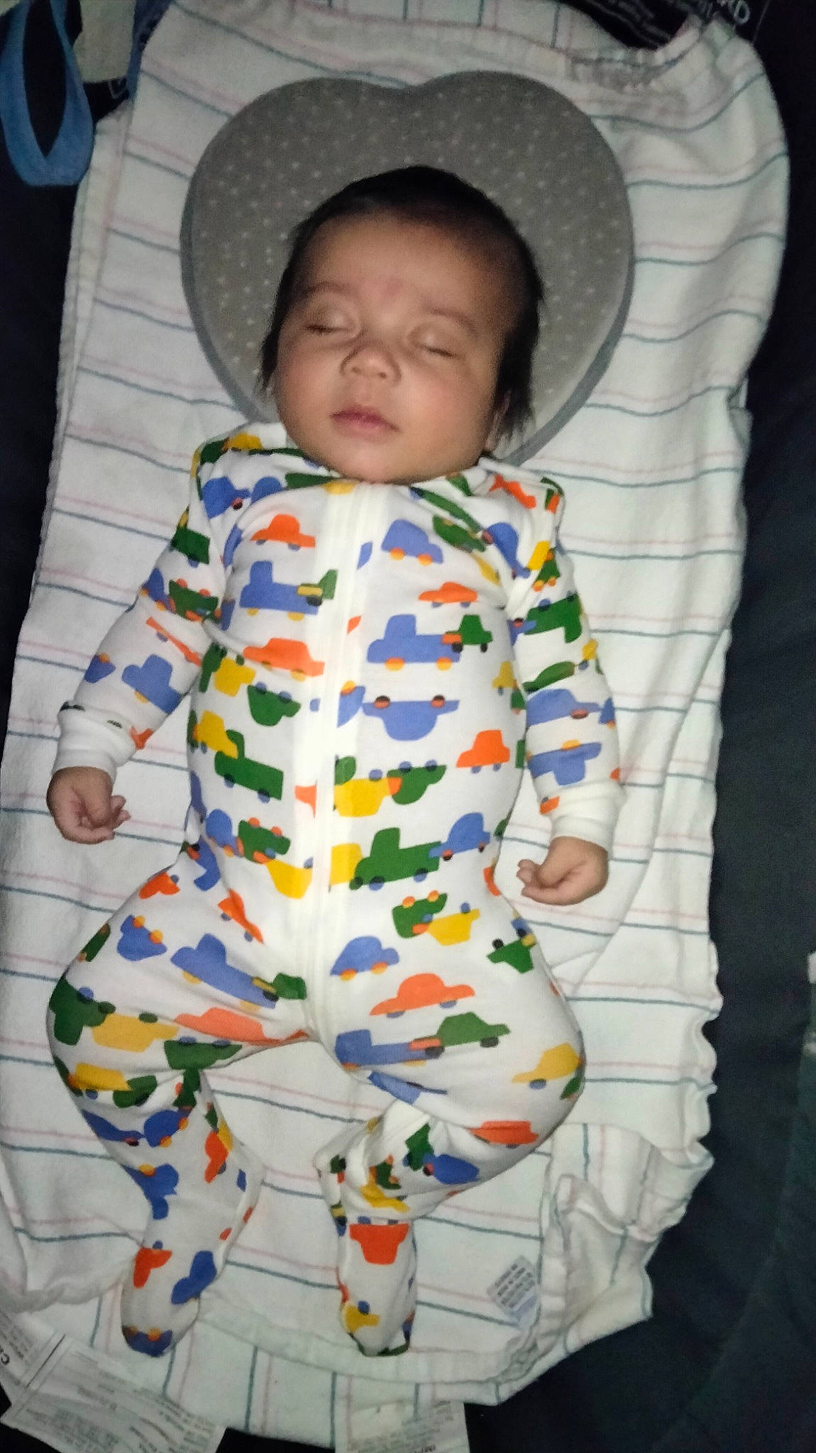 Malcolm is registered to the contest to win money with this photo: baby, baby_products, baby_safety, baby_toddler_clothing, cheek, child, comfort, face, facial_expression, head, linens, nose, pattern, person, skin, sleeve, smile, t_shirt, textile, toddler