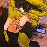 Ayla a rejoint le concours — aidez-le/la à gagner de superbes lots ! animal, bed, black_and_white_cat, cat, clothing, comfy, costume, cozy, cute, domestic, face, funny, furry, holding, indoor, person_hands, pet, phone, plush, yellow_costume