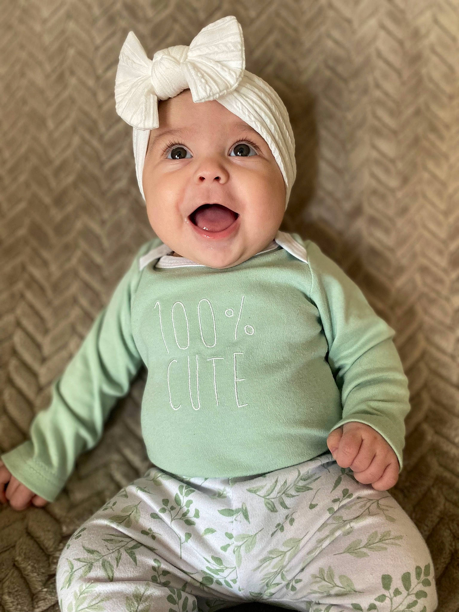 Lillian is registered to the contest to win money with this photo: baby, baby_laughing, baby_toddler_clothing, cap, cheek, child, comfort, costume_hat, face, happy, head, headwear, laugh, pattern, person, pink, portrait_photography, sitting, sleeve, smile