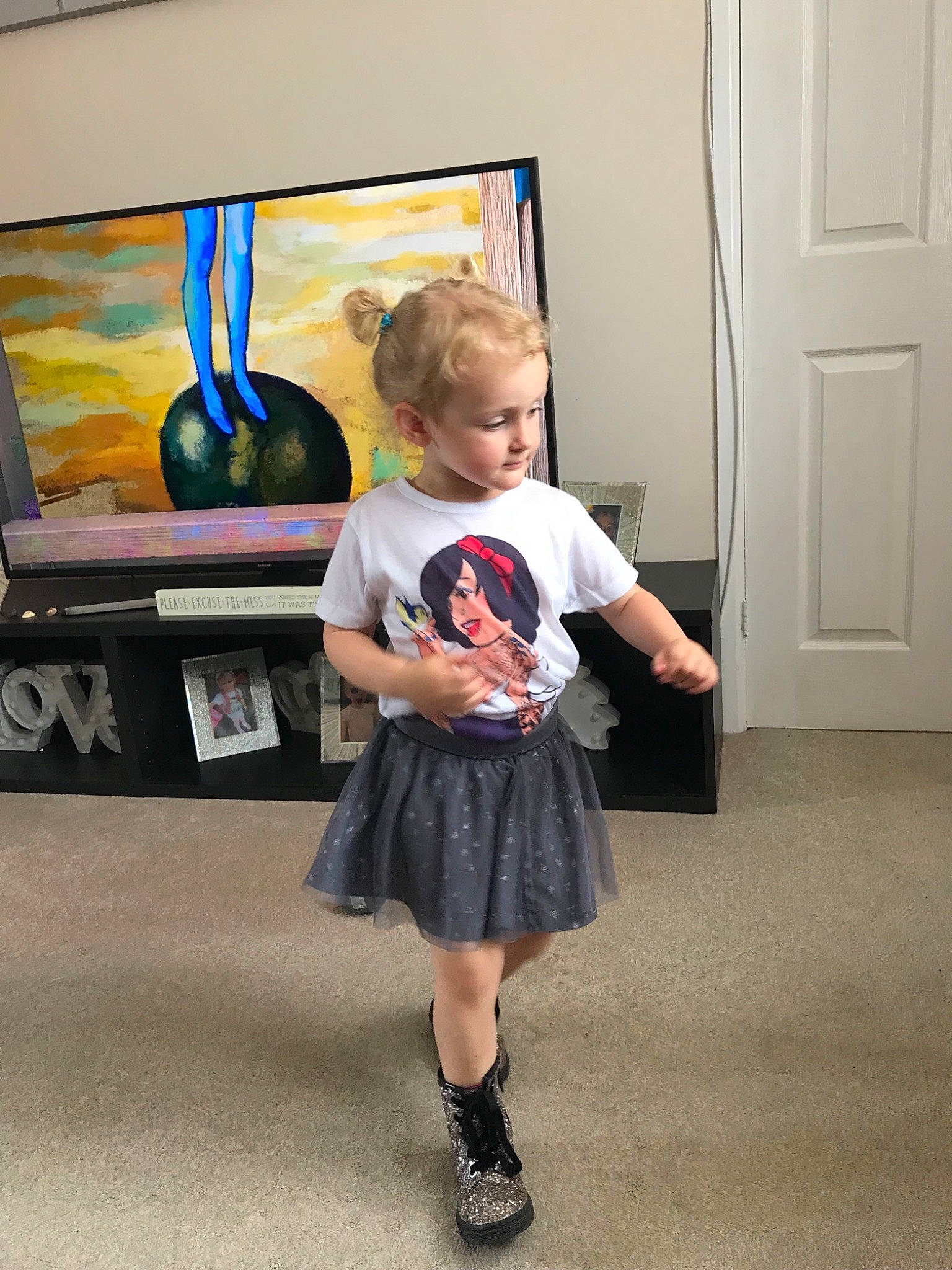 Nirvana is registered to the contest to win money with this photo: child, clothing, design, fashion, footwear, fun, joint, kilt, knee, leg, pattern, person, photography, room, shoe, shoulder, snapshot, standing, style, toddler