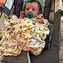 Raelynn joined the competition — help win amazing prizes! baby, pacifier, blanket, flower_pattern, baby_seat, infant, wide_eyes, cozy, indoor, fabric, child, cute, comfort, resting, seat, soft, young, person, wrapped, relaxed