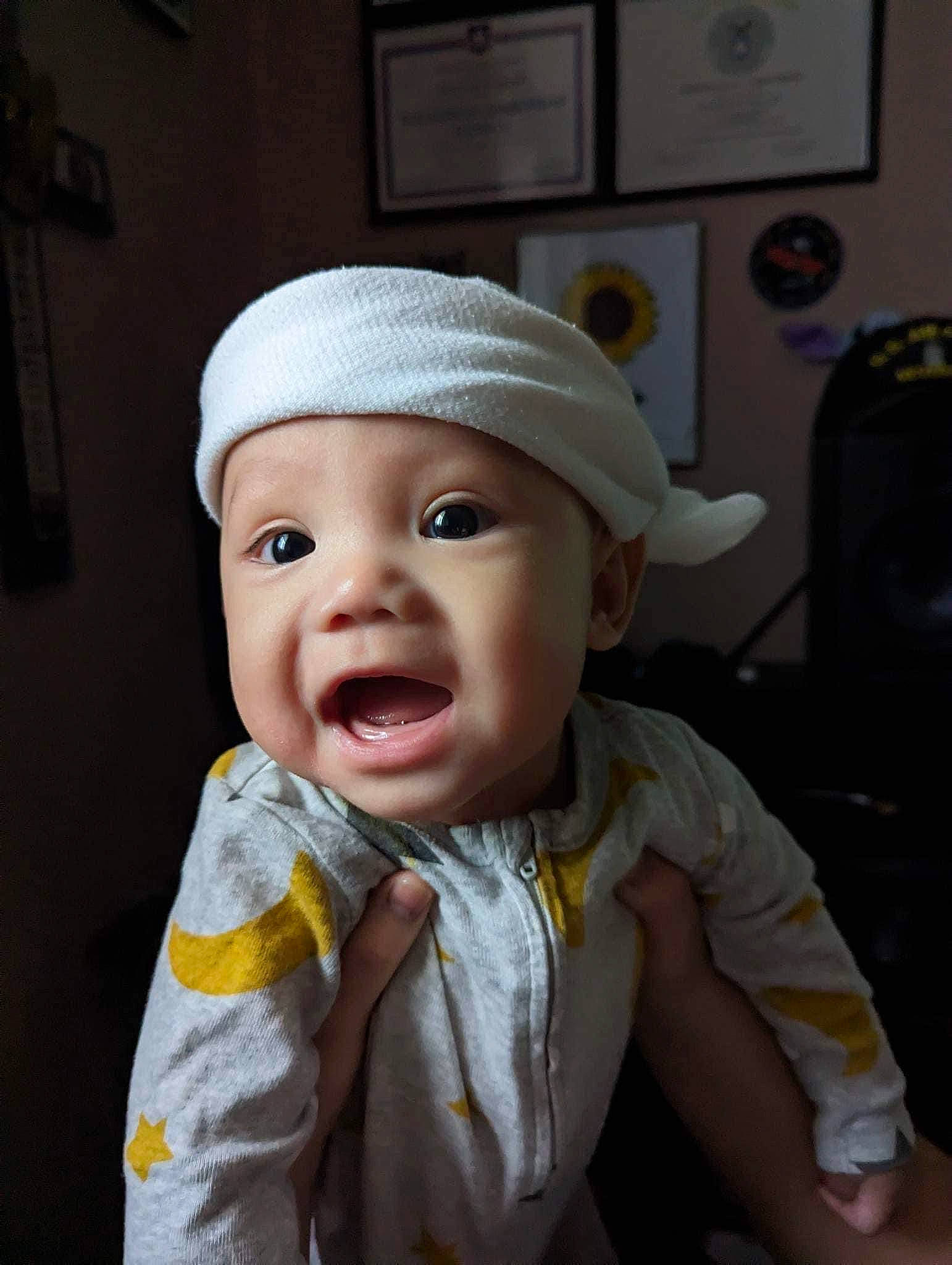 Santino joined the competition — help win amazing prizes! baby, baby_toddler_clothing, beanie, cap, cheek, child, comfort, eye, eyebrow, eyelash, fashion_accessory, fun, headwear, knit_cap, lip, nose, person, picture_frame, sitting, sleeve