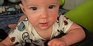 Carter joined the competition — help win amazing prizes! baby, bedroom, blanket, child, clothing, comfort, cozy, cute, face, hand, indoor, infant, looking, pattern, person, pillow, portrait, resting, soft, young