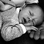 Ethan participe au concours pour gagner de l'argent avec cette photo : baby, sleeping, hand, blanket, cozy, black_and_white, infant, closeup, peaceful, cute, portrait, resting, soft, newborn, human, child, family, tender, warmth, comfort