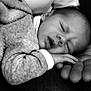 baby, sleeping, hand, blanket, cozy, black_and_white, infant, closeup, peaceful, cute, portrait, resting, soft, newborn, human, child, family, tender, warmth, comfort