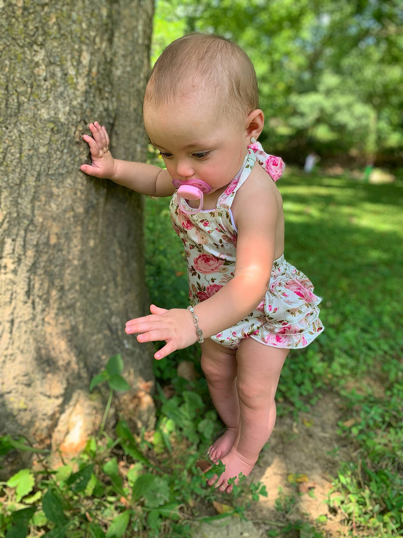 Journey Marie is registered to the contest to win money with this photo: baby, child, dress, finger, grass, green, hand, happy, joy, leaf, people_in_nature, person, pink, plant, play, skin, smile, spring, summer, toddler