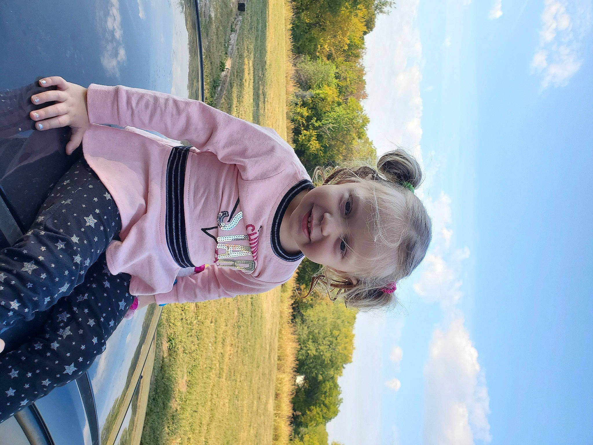 Melody is registered to the contest to win money with this photo: blue, child, cloud, eyewear, fun, grass, happy, joy, leisure, people_in_nature, person, plant, recreation, sky, toddler, tree, vacation