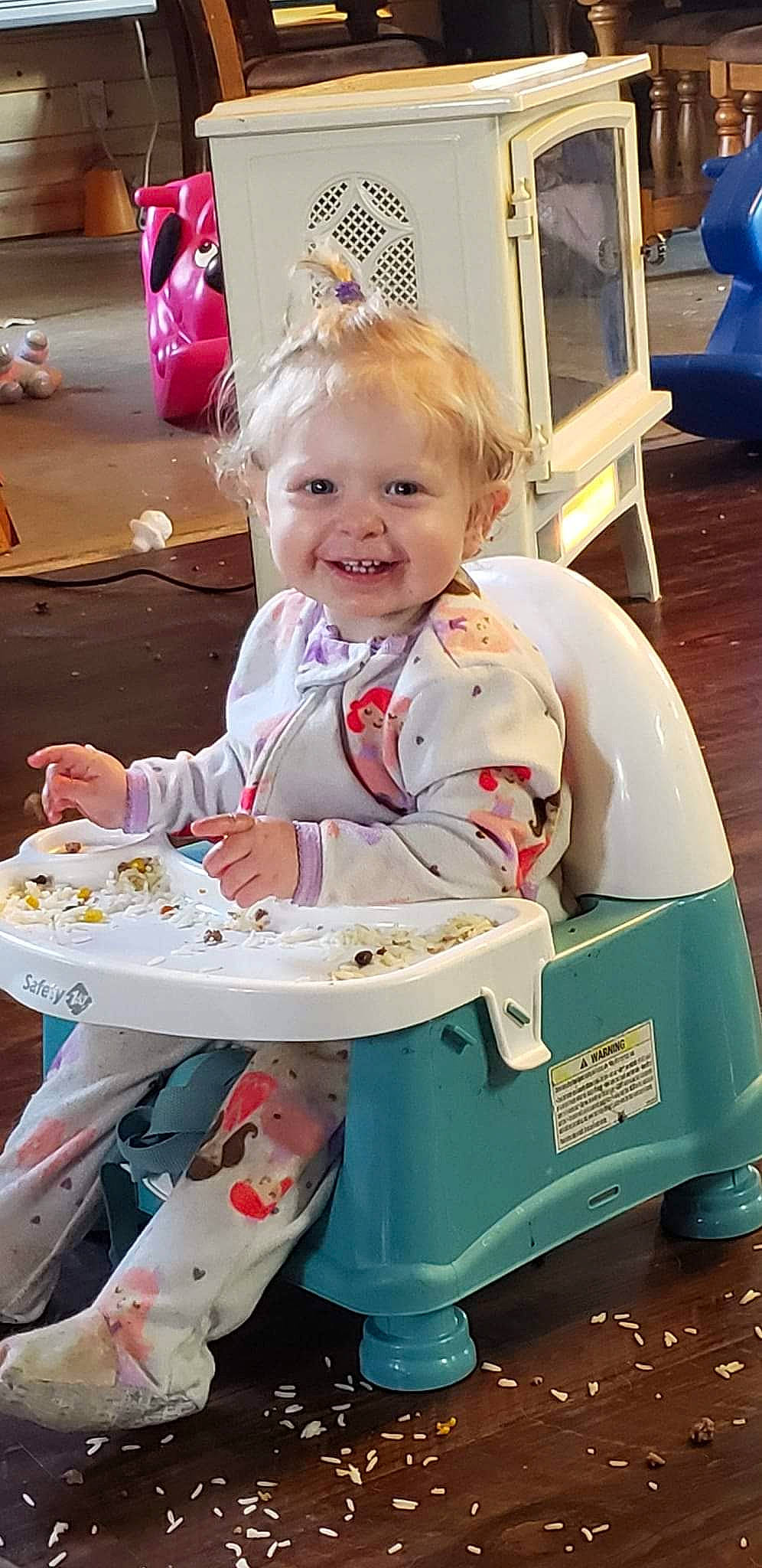 Melody is registered to the contest to win money with this photo: baby, baby_products, baby_toddler_clothing, blue, chair, child, comfort_food, cooking, event, fun, hairstyle, happy, joy, person, pink, play, room, sitting, smile, table