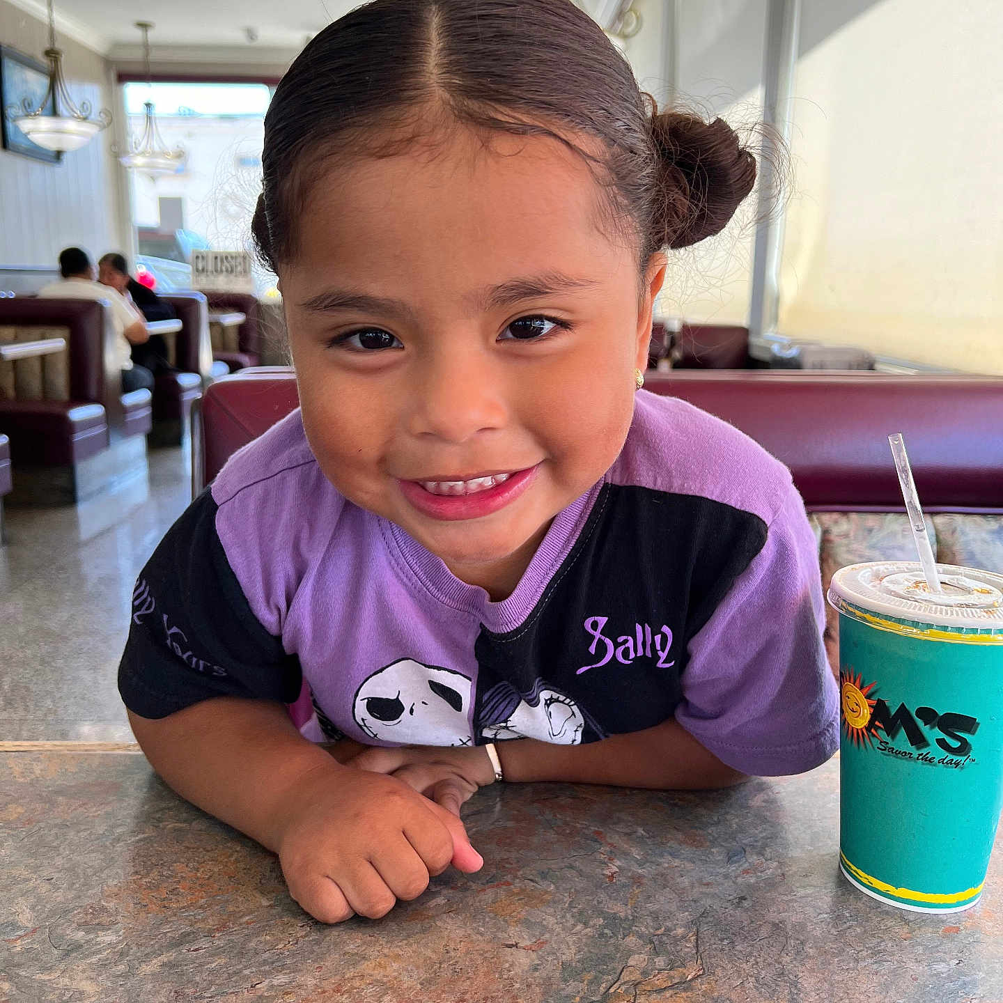 Quetzalli joined the competition — help win amazing prizes! adult, beverage, bodypart, child, cup, disposablecup, face, female, finger, girl, hand, head, indoors, juice, lamp, person, photography, portrait, restaurant, woman