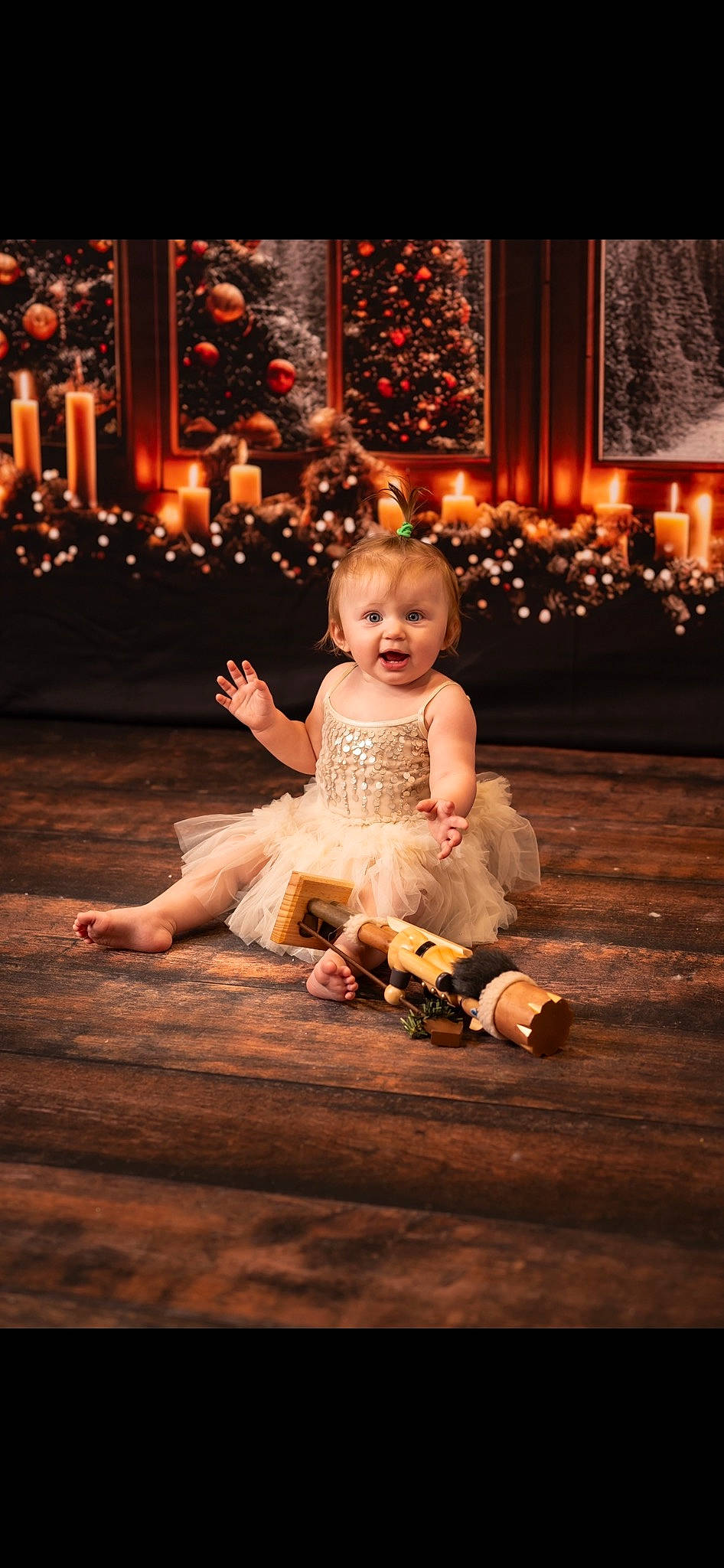 Magnolia is registered to the contest to win money with this photo: baby, child, dress, entertainment, event, flash_photography, floor, flooring, fun, happy, hardwood, human_body, lighting, performance_art, performing_arts, person, plant, sitting, surprise, toddler
