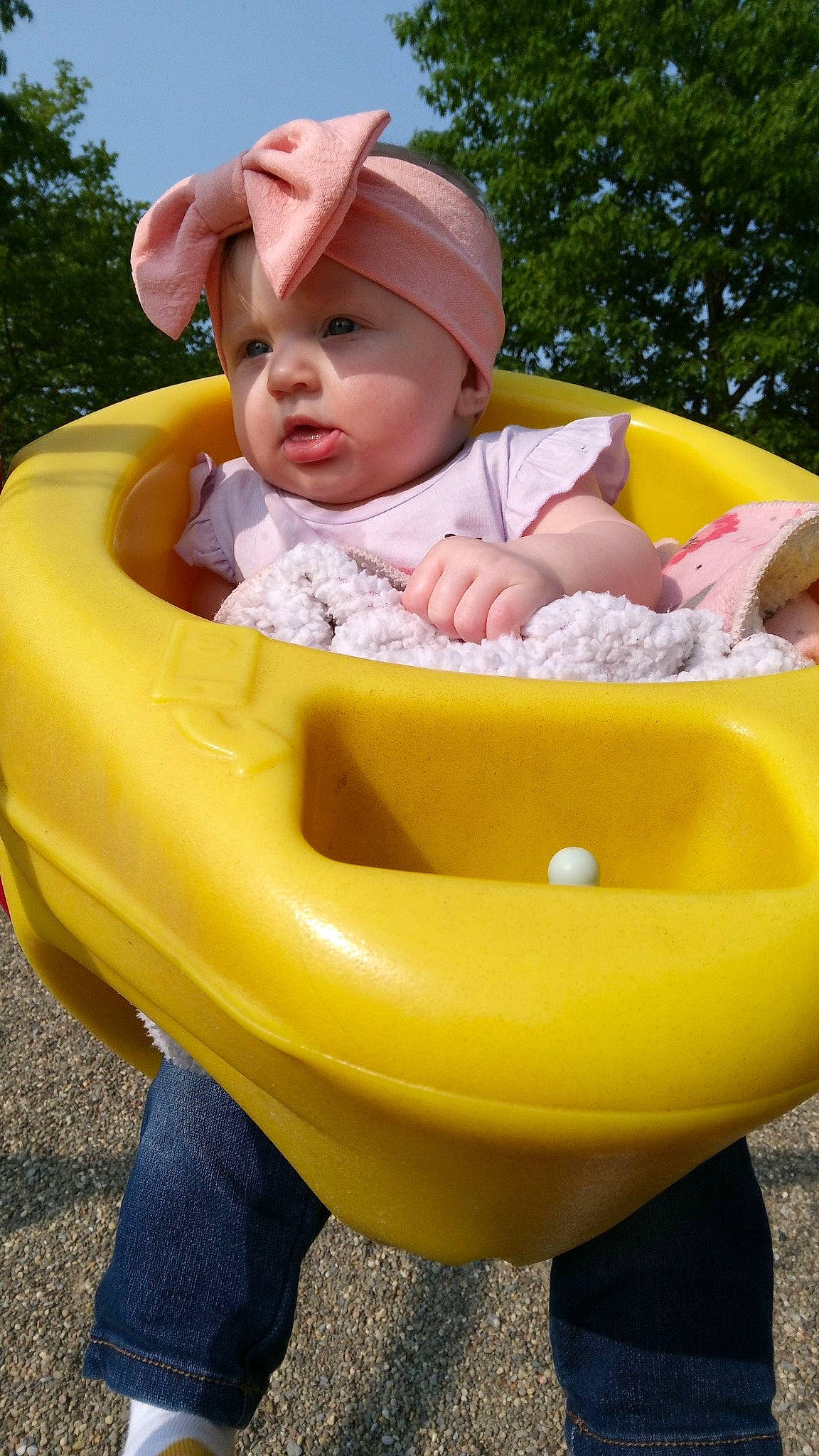 Magnolia is registered to the contest to win money with this photo: baby, baby_products, baby_toddler_clothing, bib, cap, child, fun, grass, happy, hat, headwear, leisure, people_in_nature, person, pink, plant, product, recreation, red, sitting