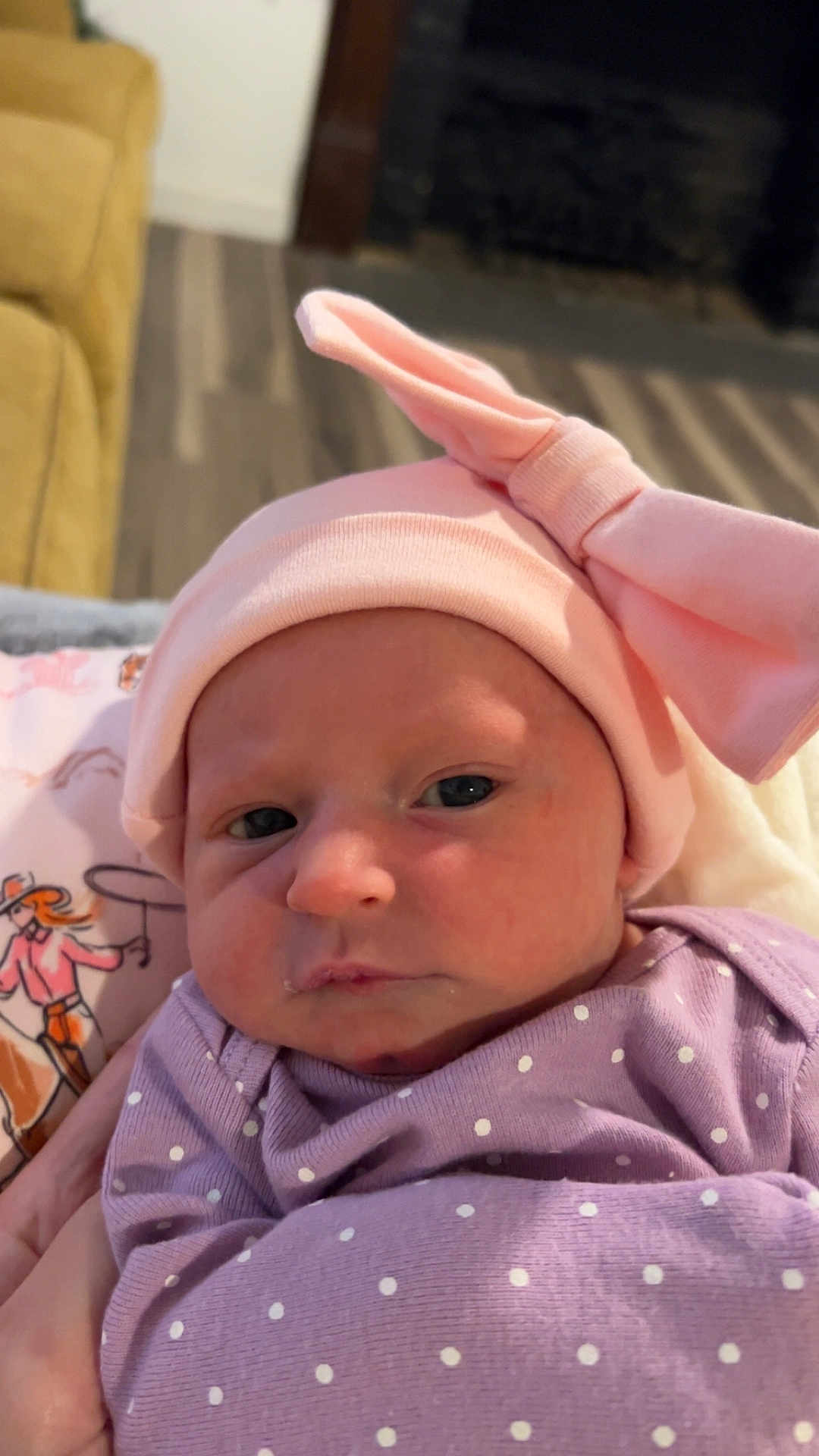 Mia joined the competition — help win amazing prizes! baby, infant, pink_hat, bow, purple_clothing, polka_dot, face, indoor, portrait, cute, newborn, child, soft_lighting, closeup, person, headwear, apparel, human, looking, expression