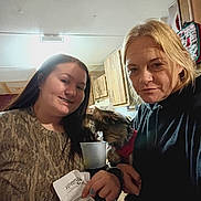 Chloe joined the competition — help win amazing prizes! blonde_hair, bottle, cabinet, casual_clothing, dog, drink, face, holding, home, indoor, kitchen, light, long_hair, people, portrait, receipt, small_dog, smile, woman, wooden_furniture