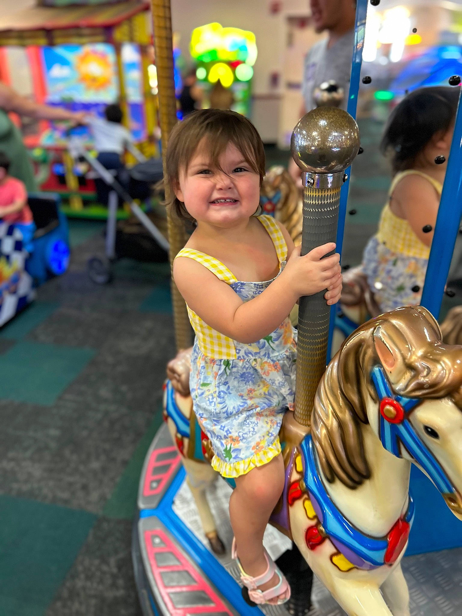 Aspen is registered to the contest to win money with this photo: amusement_park, amusement_ride, blue, carousel, child, event, fun, happy, horse, horse_supplies, horse_tack, joy, leisure, nonbuilding_structure, person, photograph, play, recreation, smile, snapshot