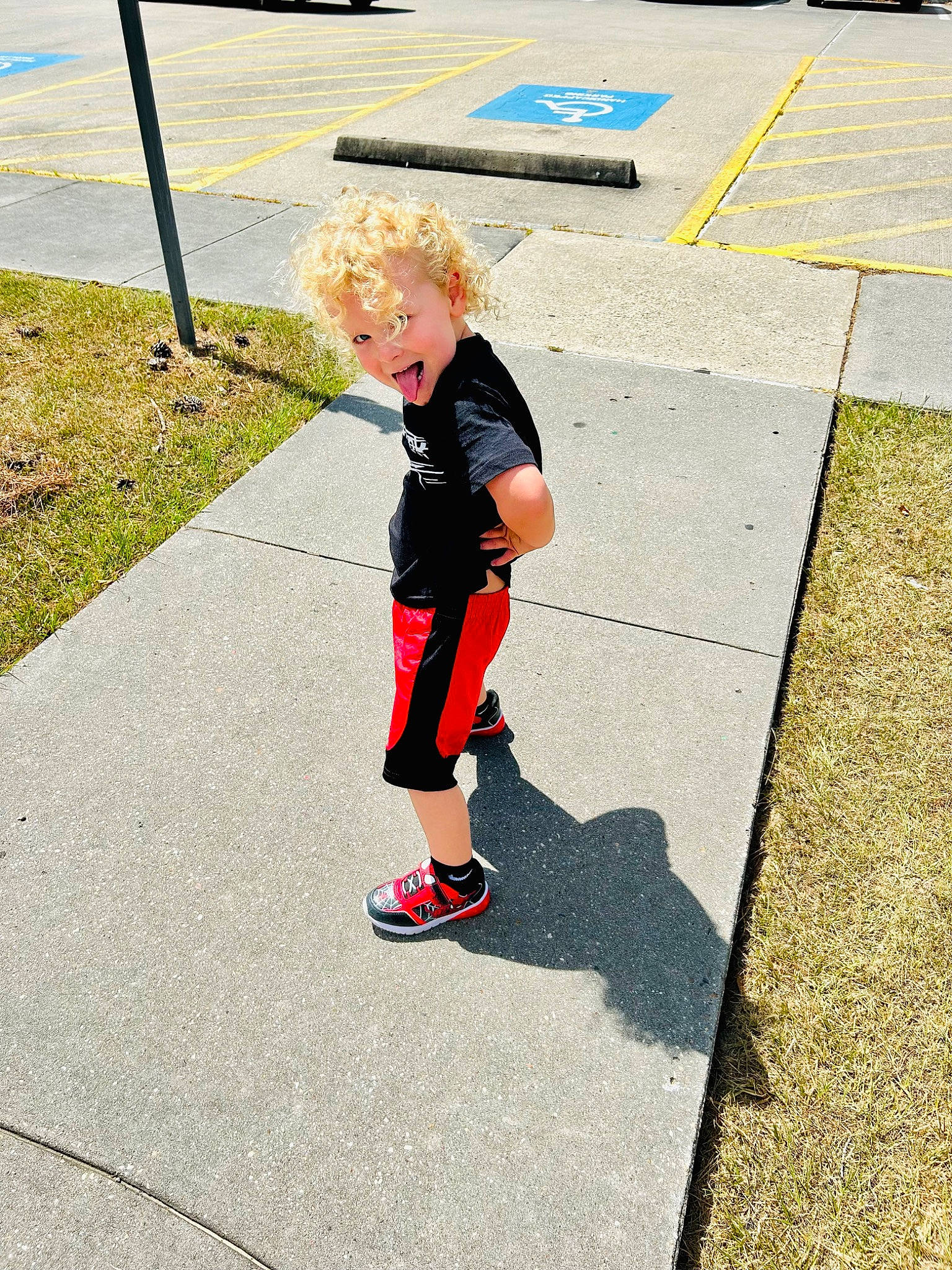 Blake joined the competition — help win amazing prizes! asphalt, electric_blue, footwear, fun, grass, human_leg, knee, lane, leisure, pedestrian, person, plant, recreation, road, road_surface, shorts, sidewalk, street, tar, toddler