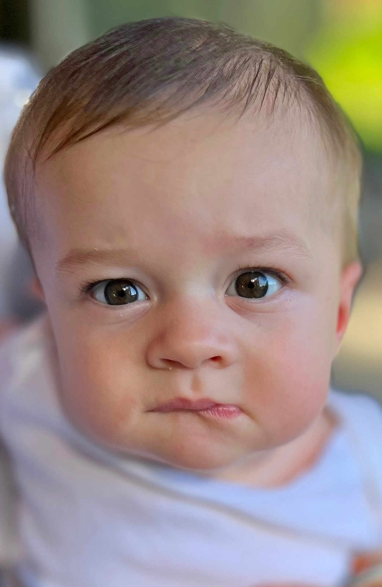 Wesley joined the competition — help win amazing prizes! baby, face, portrait, child, close_up, expression, eyes, skin, head, infant, person, cute, young, white_clothing, soft_focus, background_blur, indoors, human, looking, serious