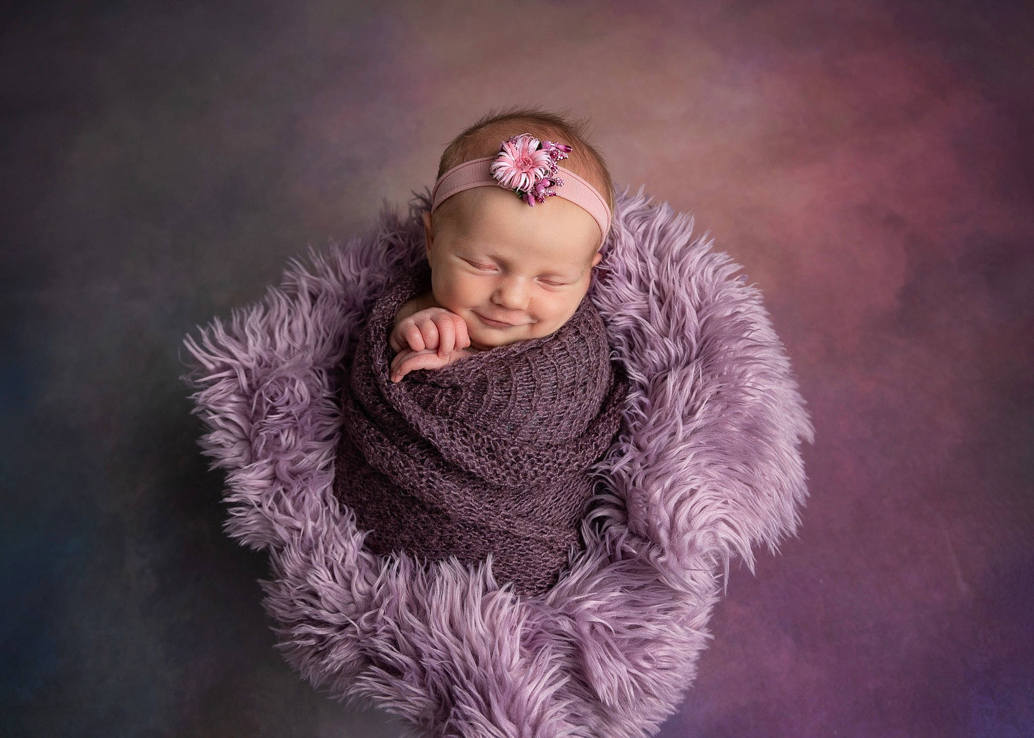 Alice is registered to the contest to win money with this photo: baby, child, cloud, electric_blue, eye, face, fashion_accessory, flash_photography, fun, fur, fur_clothing, happy, head, headgear, headwear, magenta, people_in_nature, person, purple, smile