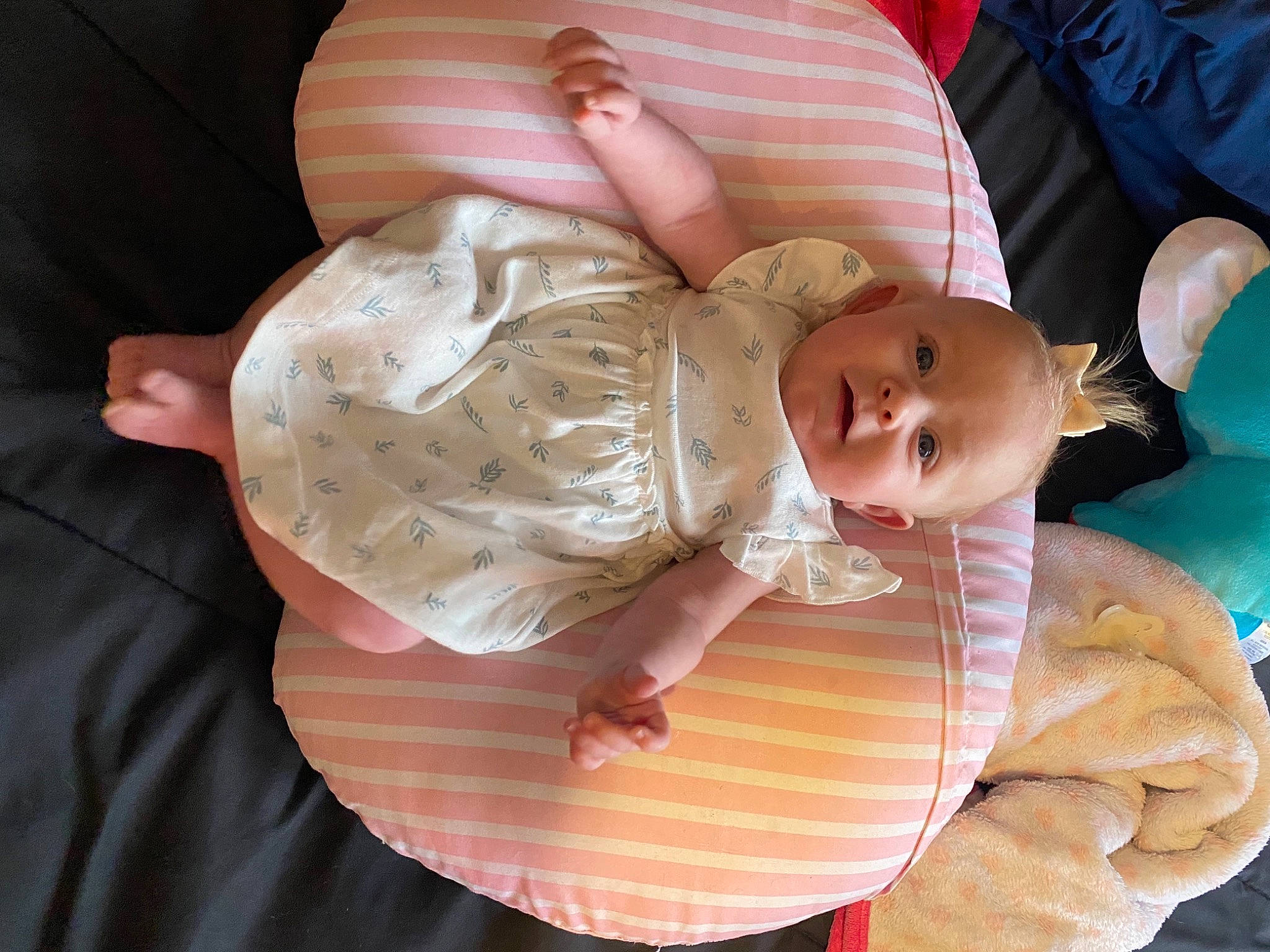 Addisyn is registered to the contest to win money with this photo: abdomen, baby, baby_products, baby_toddler_clothing, cheek, child, comfort, eye, happy, human_body, iris, mouth, peach, person, pink, room, sitting, skin, thumb, toddler