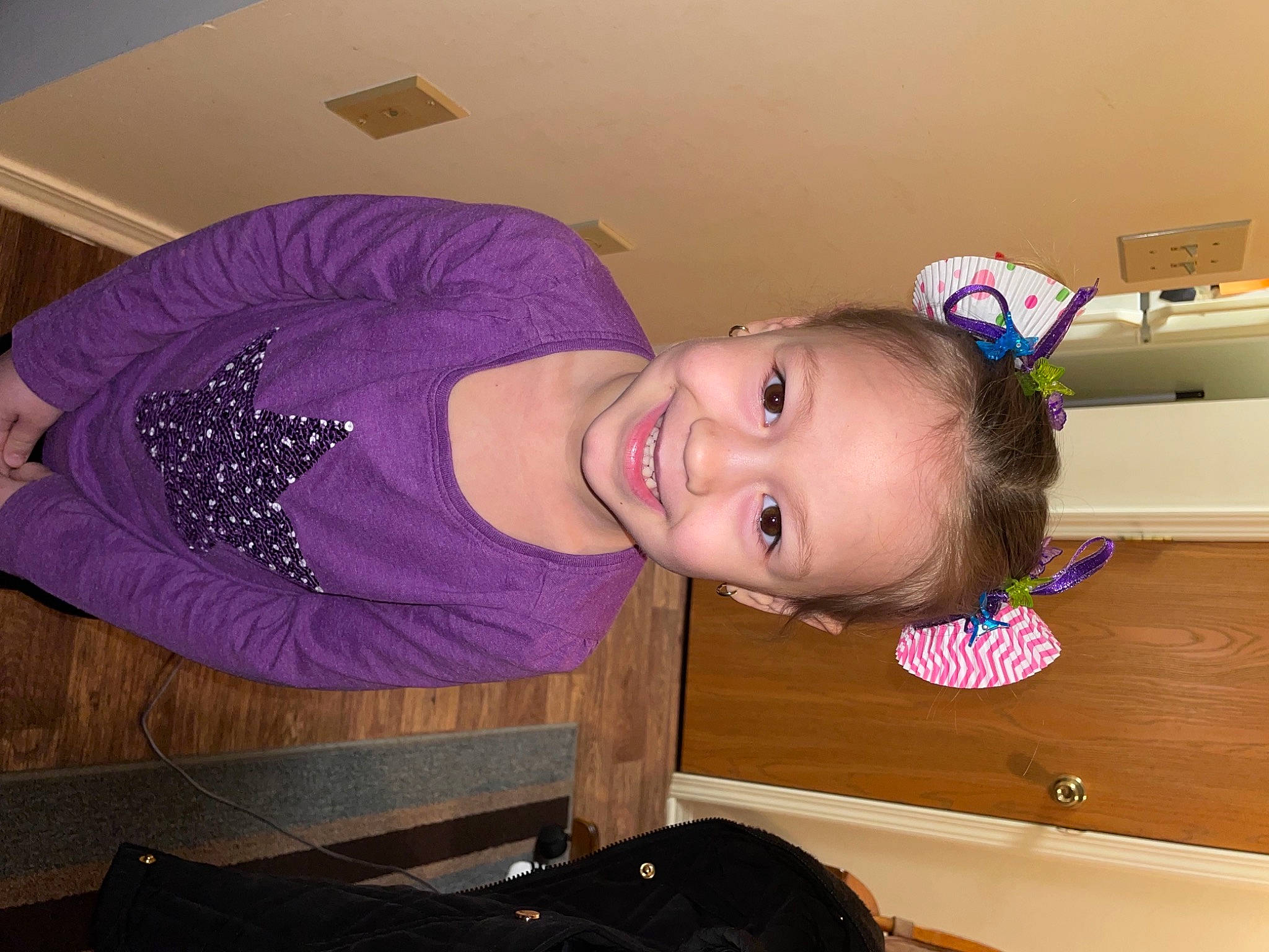 Emmarae is registered to the contest to win money with this photo: baby, baby_toddler_clothing, chest, child, ear, eyebrow, fun, hairstyle, happy, hat, headgear, human_body, joy, magenta, mouth, person, purple, room, sleeve, smile