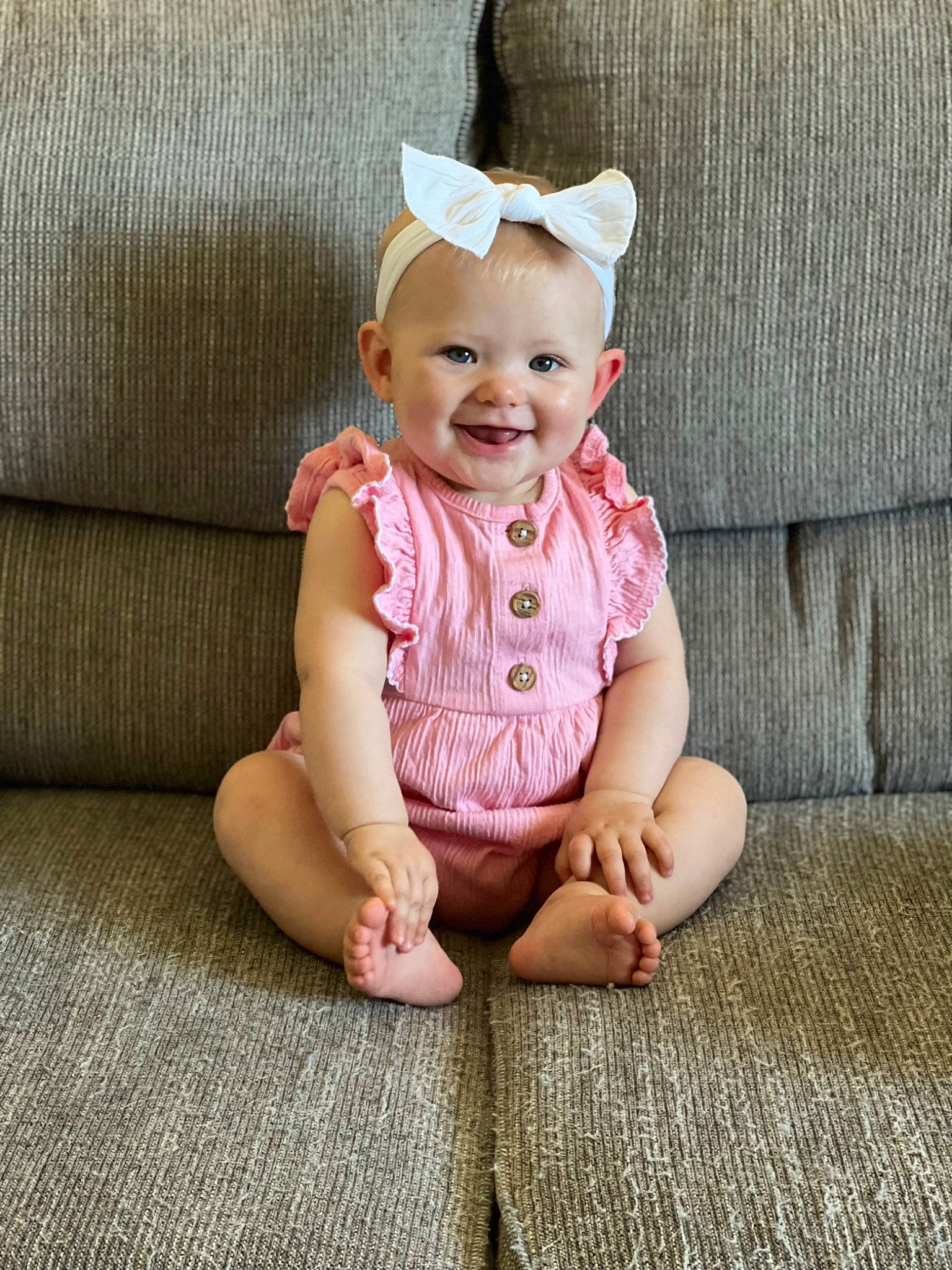 Rosalie joined the competition — help win amazing prizes! baby, baby_toddler_clothing, child, dress, fashion_accessory, flooring, foot, grass, happy, hat, joy, magenta, pattern, peach, person, sitting, sleeve, smile, t_shirt, textile
