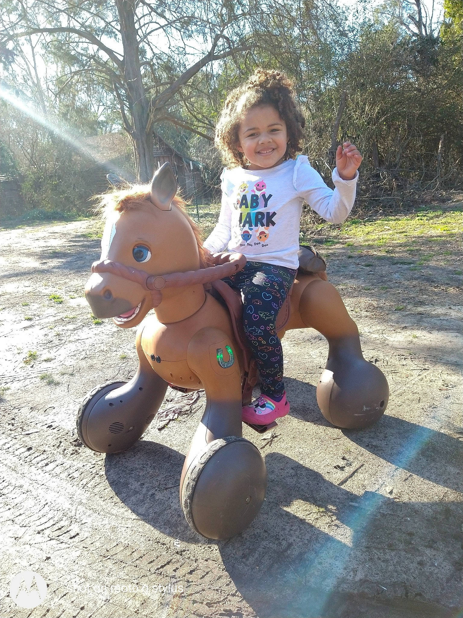 Ava is registered to the contest to win money with this photo: botany, fawn, fun, grass, happy, human_leg, joy, leaf, leisure, person, plant, recreation, shoe, shorts, sitting, smile, sneakers, t_shirt, thigh, toddler