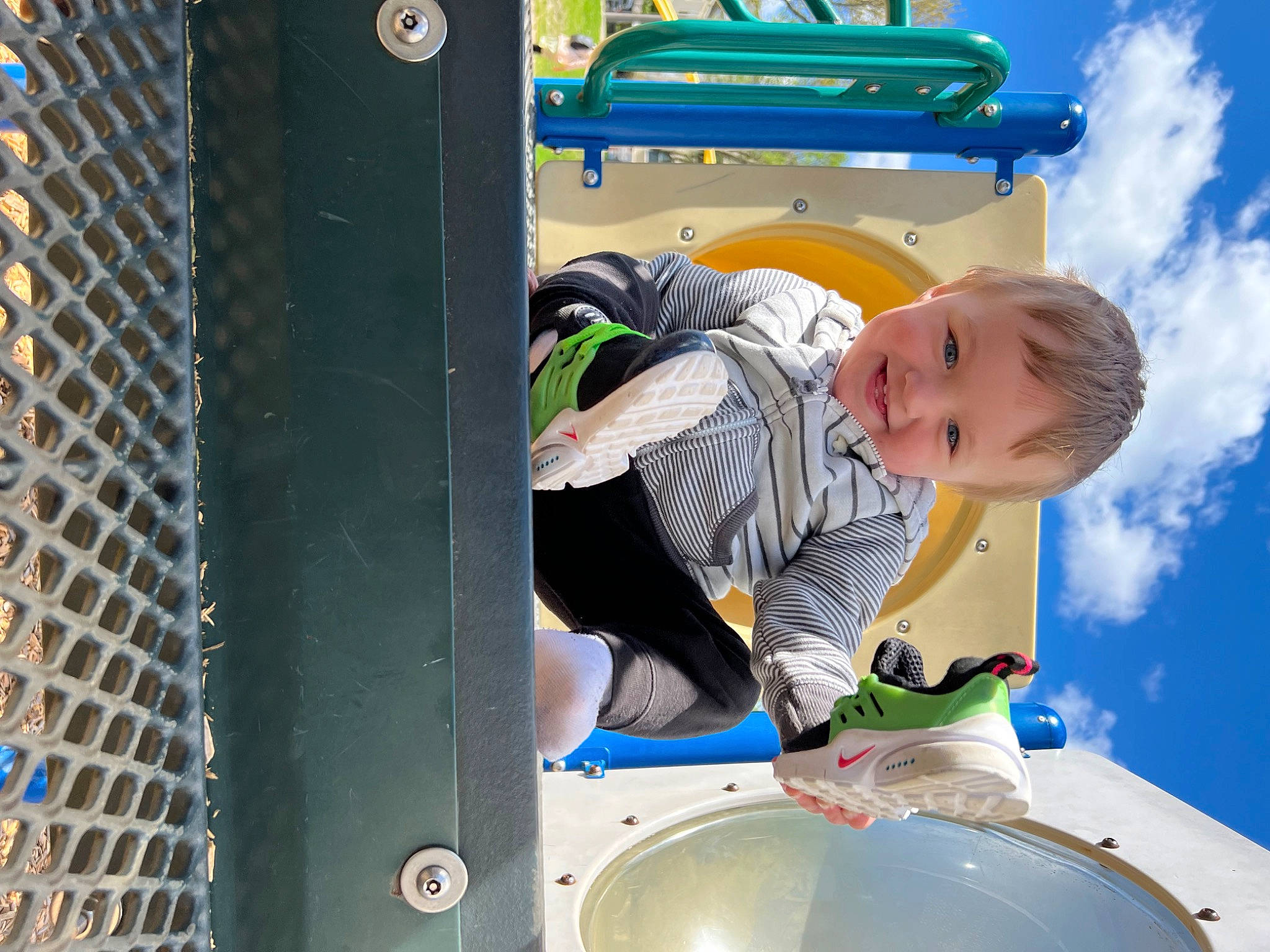 Augustus is registered to the contest to win money with this photo: automotive_exterior, baby, baby_toddler_clothing, blue, bumper, child, city, cloud, fun, gas, happy, joy, leisure, machine, motor_vehicle, person, playground, recreation, sky, toddler