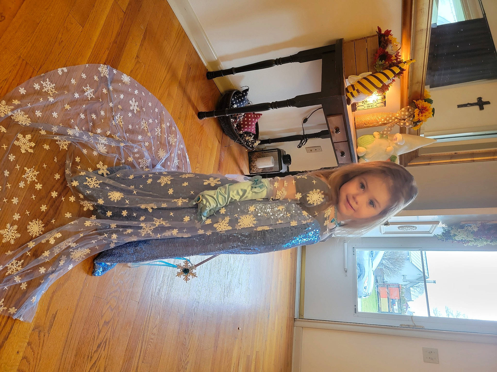 Dahlia is registered to the contest to win money with this photo: building, ceiling, curtain, flooring, fun, hardwood, joy, pattern, person, picture_frame, room, smile, varnish, window, wood, wood_flooring, wood_stain