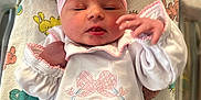 Sadie is registered to the contest to win money with this photo: newborn, baby, infant, pink_bow, headband, white_outfit, blanket, hospital, bassinet, baby_clothes, patterned_blanket, lying_down, portrait, cute, sleepy, newborn_baby, baby_girl, soft_lighting, closeup, hospital_id