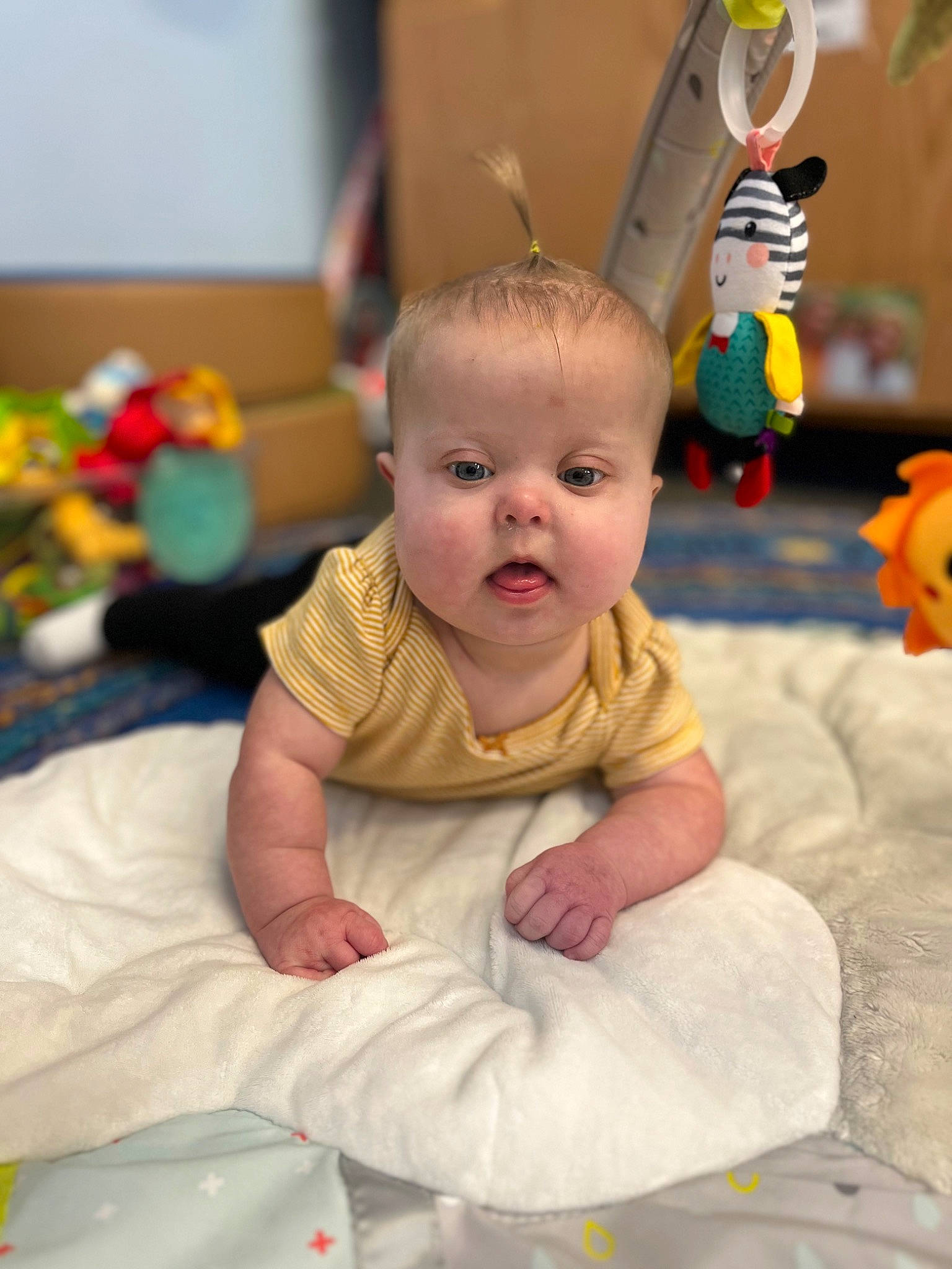 Jaylynn joined the competition — help win amazing prizes! baby, baby_products, baby_toddler_clothing, baby_toys, child, dress, event, eye, face, flooring, fun, happy, head, linens, people, person, play, room, sitting, surprise