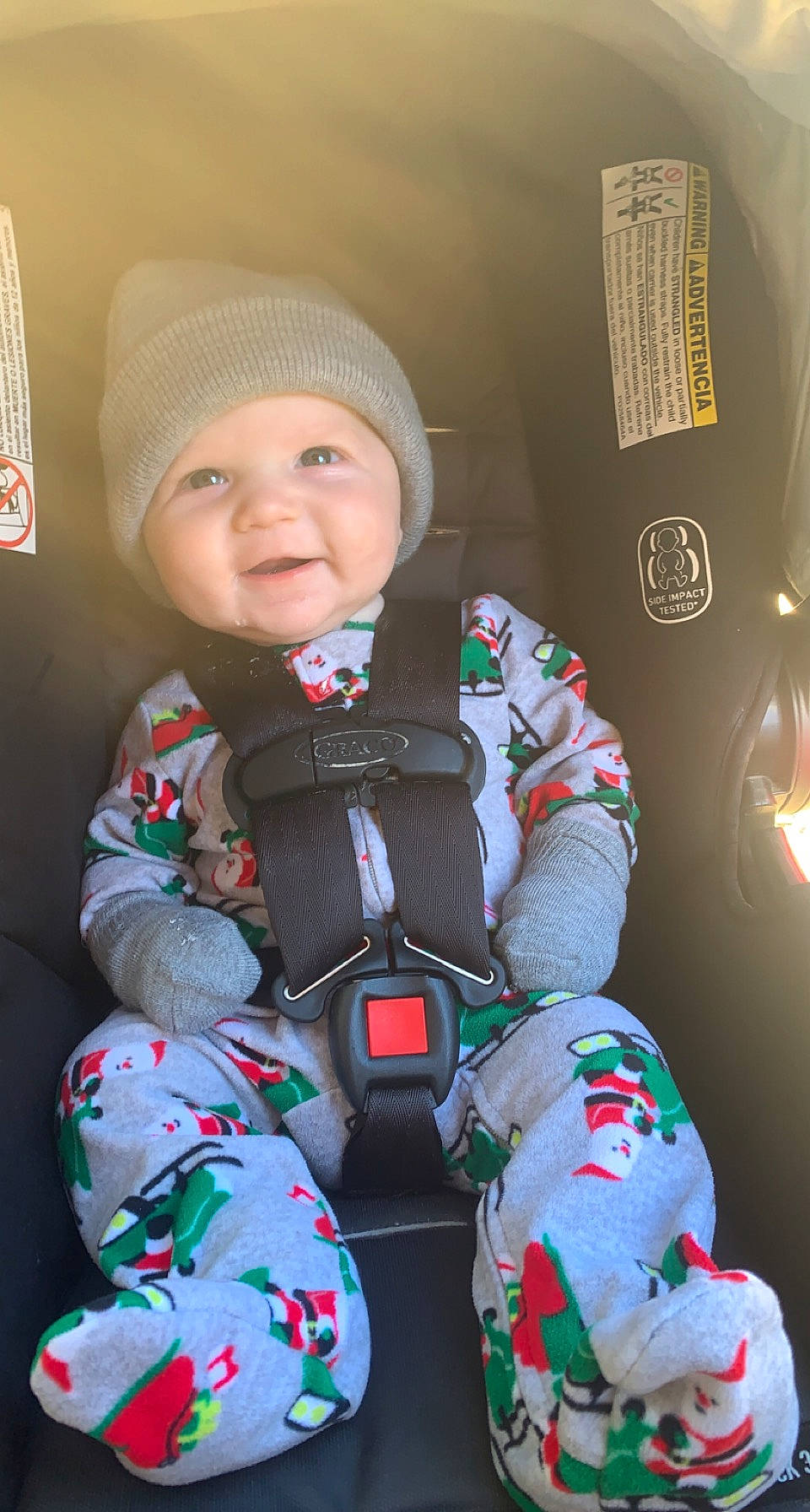 Callen is registered to the contest to win money with this photo: auto_part, baby, baby_products, baby_toddler_clothing, cap, car_seat, carmine, child, comfort, fun, happy, headwear, outerwear, person, personal_protective_equipment, seat_belt, sitting, skin, sleeve, smile