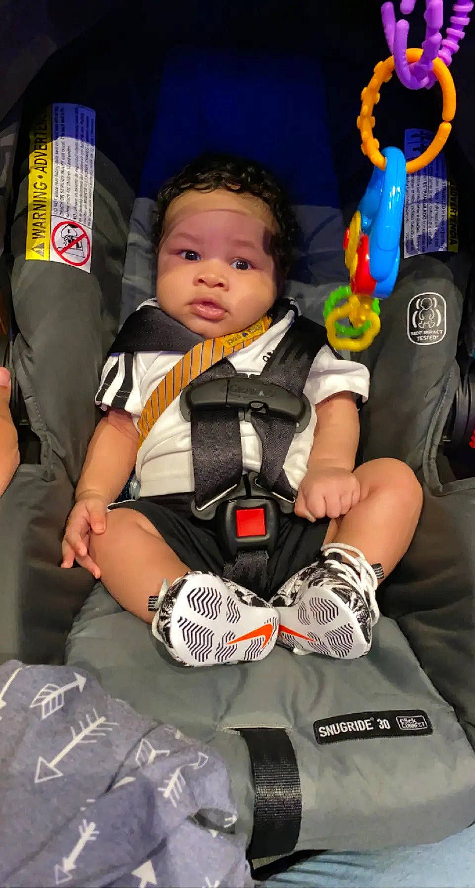 Dakota is registered to the contest to win money with this photo: baby, baby_carriage, baby_products, baby_toddler_clothing, bag, car_seat, child, comfort, fun, happy, luggage_and_bags, pattern, person, product, sitting, sleeve, sock, t_shirt, thigh, toddler