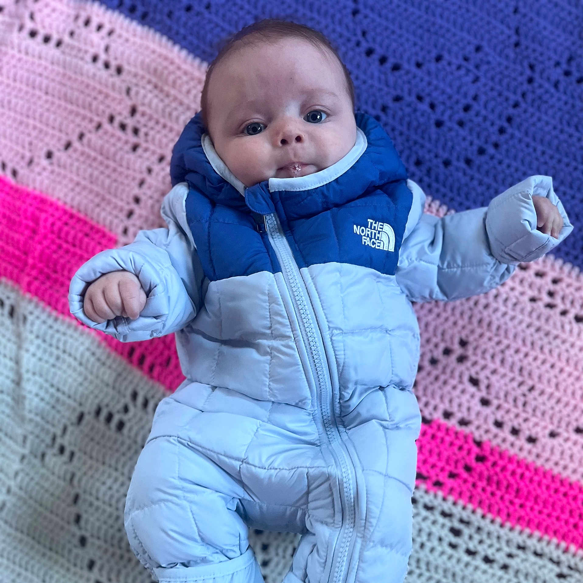 Saylor is registered to the contest to win money with this photo: baby, babylaughing, clothing, coat, face, glove, happy, head, hood, jacket, jeans, newborn, pants, person, photography, portrait, sitting, sleeve, smile, yawning