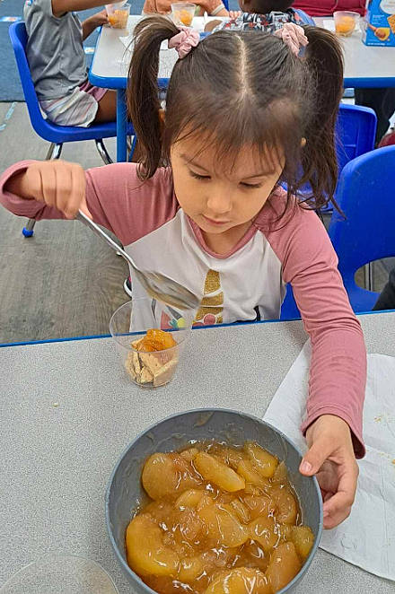 Jocelyn is registered to the contest to win money with this photo: chair, child, comfort_food, cuisine, dessert, dish, event, finger_food, food, ingredient, junk_food, person, plate, platter, produce, sharing, side_dish, table, tableware, toddler