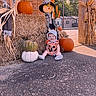 Blakely is registered to the contest to win money with this photo: baby, child, smiling, autumn, halloween, pumpkins, hay_bale, scarecrow, sunflower, corn_stalks, outdoor, fall_decor, costume, hat, bib, mickey_mouse, brick_wall, porch, portrait, pumpkin_patch
