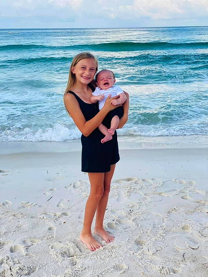 Aubrie joined the competition — help win amazing prizes! aqua, azure, beach, cloud, coastal_and_oceanic_landforms, flash_photography, fun, gesture, happy, joy, leisure, natural_environment, people_in_nature, people_on_beach, person, sand, sky, smile, sorrow, standing