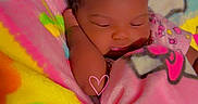 Kaylee joined the competition — help win amazing prizes! adorable, baby, blanket, child, colorful, comfort, cozy, cute, face, hand, indoors, infant, peaceful, portrait, rest, sleeping, soft, toddler, warm, wrapped