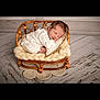 Noah joined the competition — help win amazing prizes! baby, newborn, sleeping, wicker_chair, knitted_blanket, cozy, neutral_colors, wooden_floor, infant, peaceful, cute, small_furniture, portrait, soft_texture, cushion, indoors, resting, child, cute_baby, warm